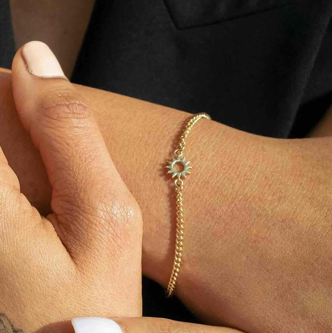 Model wearing Baby Spur Chain Bracelet in yellow gold