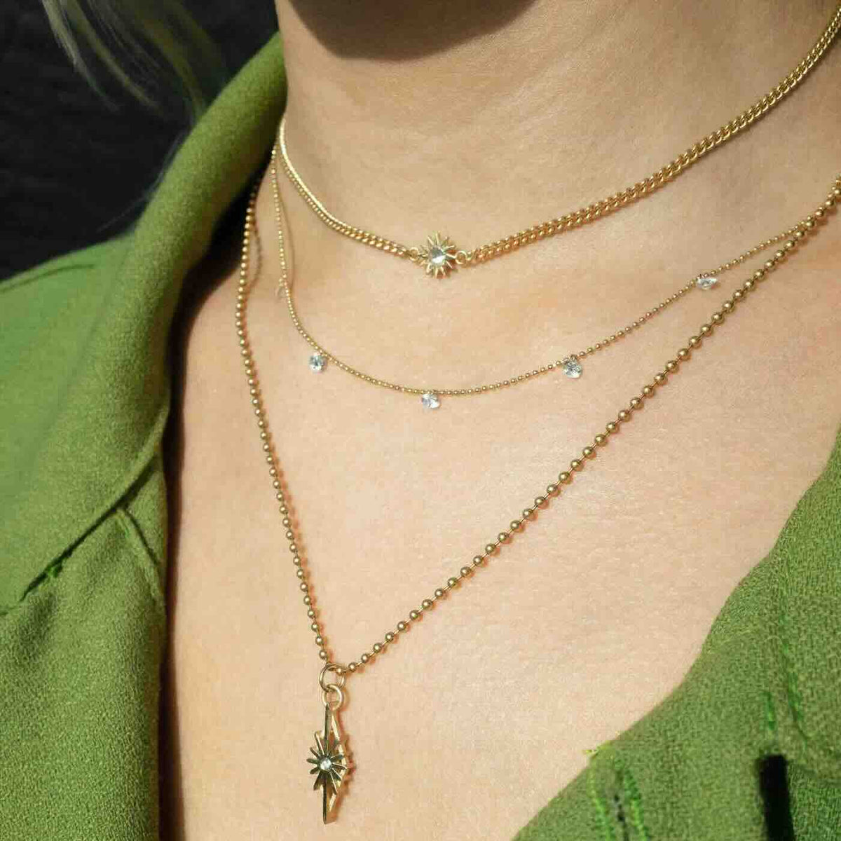 Model wearing Baby Spur Chain Necklace in yellow gold with white diamond