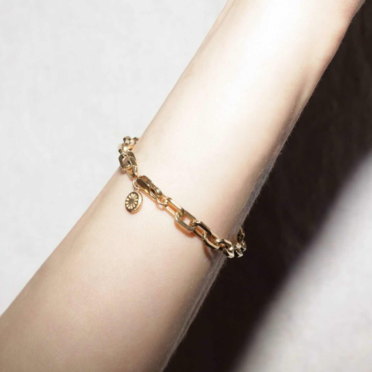 Model wearing Chain Link Bracelet in yellow gold