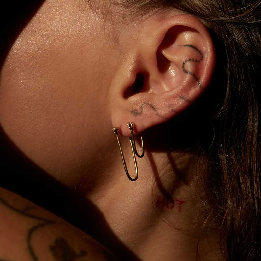 Model wearing Half Latch Earring in yellow gold