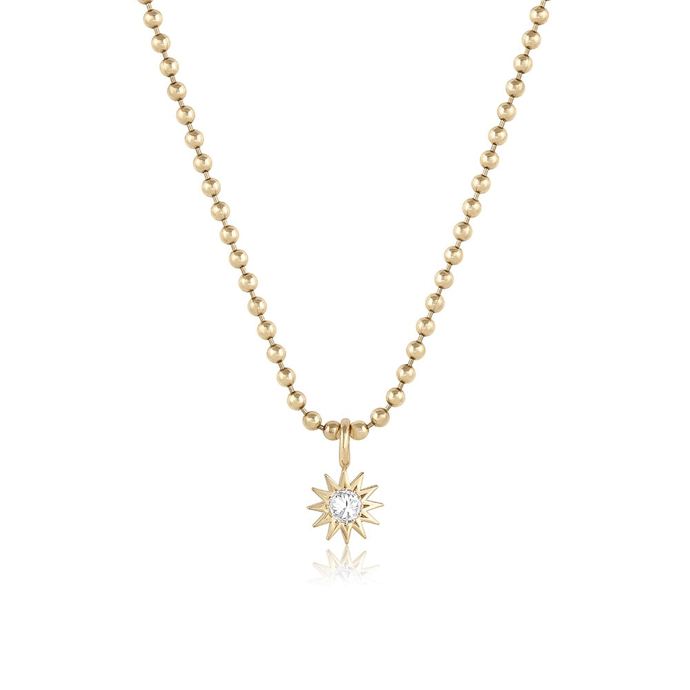 Inverted Diamond Spur Pendant in yellow gold with white diamond, front view