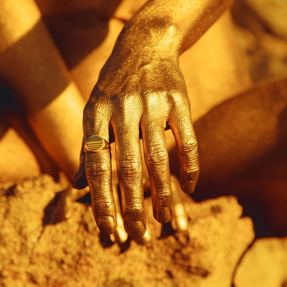 Model wearing Lost Sun Ring in yellow gold