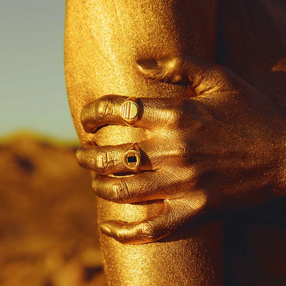 Model wearing Lost Sun Ring in yellow gold