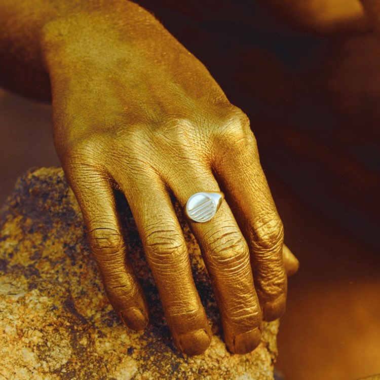 Model wearing Lost Sun Ring in sterling silver