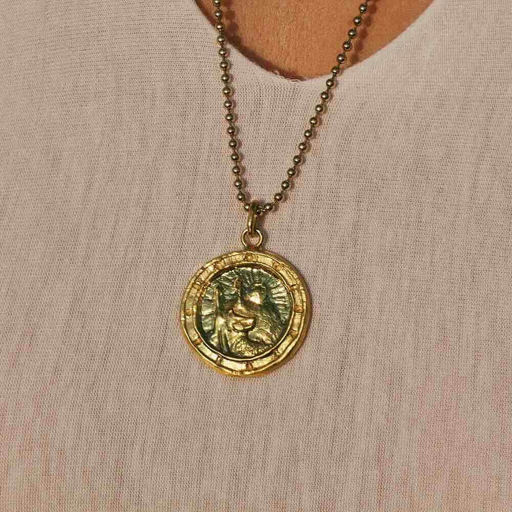 Model wearing Saint Christopher Pendant in yellow gold
